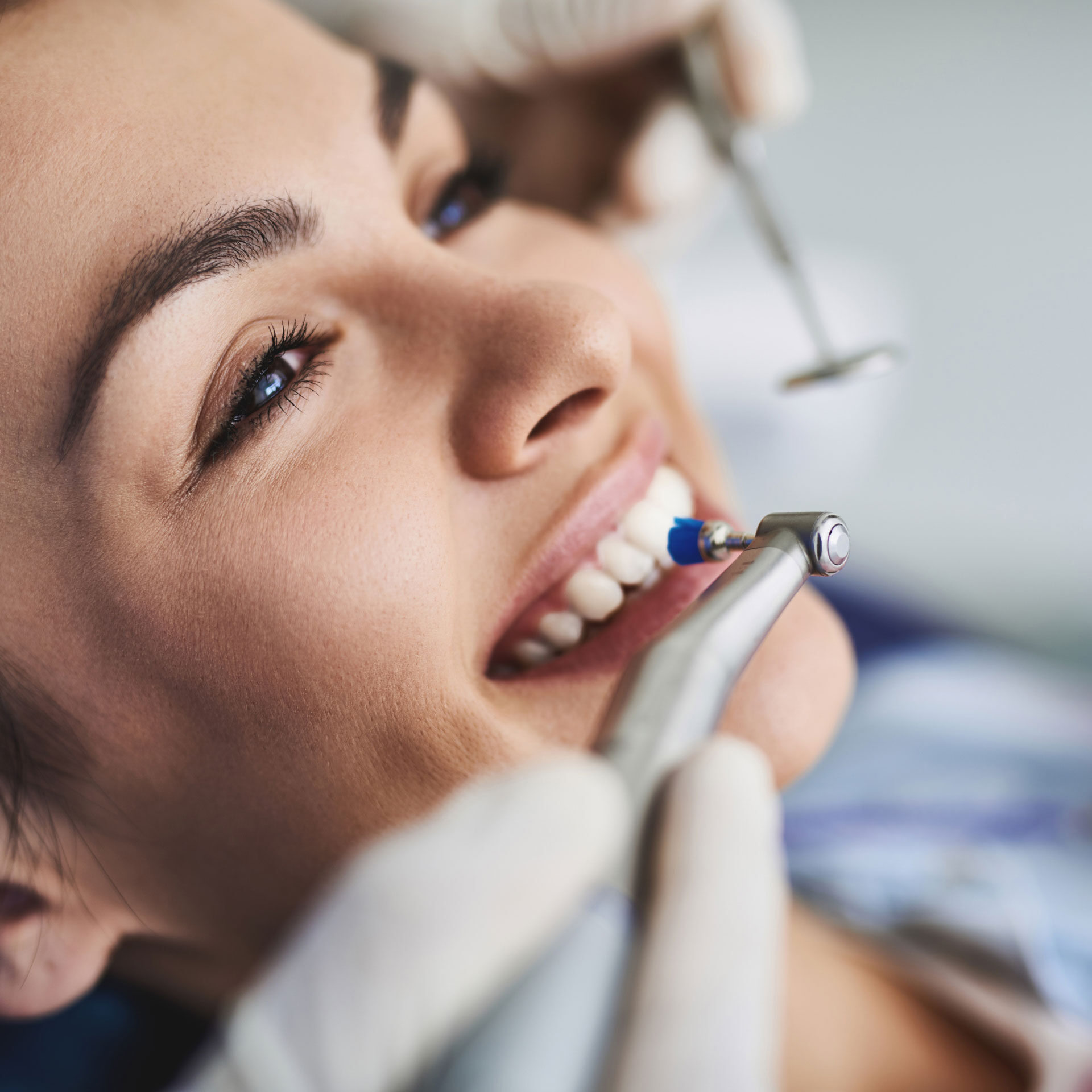 woman having teeth cleaned